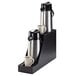 A black bamboo Cal-Mil dual airpot stand with drip trays holding two coffee thermoses.