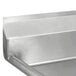 A close up of an Advance Tabco metal one compartment sink with a left drainboard.