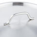 A Vollrath stainless steel pan cover with a metal handle.