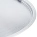A Vollrath stainless steel pot lid with a circular rim.