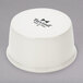 A white Tuxton china ramekin.