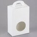 A white candy box with a circular window.