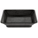 A black square dish with a handle.