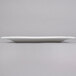 A white rectangular Arcoroc porcelain platter.