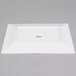 A white rectangular Arcoroc porcelain platter.