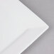 A white Arcoroc porcelain square side plate with a white edge.