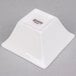 A white square Arcoroc flared bowl with a black logo.