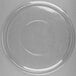 A clear plastic lid with a circular rim on a white surface.