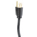 A black electrical cord with gold connectors.