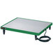 A green and white rectangular Hatco heated shelf warmer on a table.