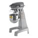 A Hobart Legacy+ floor mixer with a bowl on a stand.