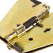 A brass FMP table hinge with a spring.