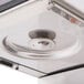 A Bunn stainless steel automatic coffee brewer on a metal surface.