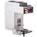 A Bunn automatic coffee brewer with stainless steel funnel.