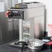 A Bunn automatic coffee brewer with upper and lower warmers on a counter.