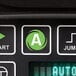 The control panel of a Hamilton Beach Summit bar blender with a close up of a button.