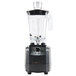 A Hamilton Beach commercial food blender with a clear container and black base.