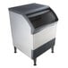 A stainless steel Scotsman undercounter ice machine with a glass door.