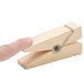 An American Metalcraft natural wooden clothespin card holder.