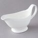 An American Metalcraft white porcelain gravy boat on a gray background.