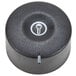 A black round temperature control knob with a white circle on it.