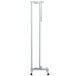 A white metal stand with a long pole.