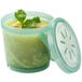 A close up of a jade green GET reusable soup container with a lid.