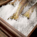 Fish on ice in a Scotsman wooden box.