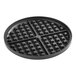 A black waffle iron top grid with square grids.