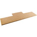 A rectangular bamboo shelf on a wooden table.