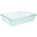 A clear plastic Carlisle food storage box with a green lid.