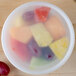 A bowl of fruit in a Pactiv translucent plastic deli container.