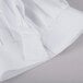 A close-up of a white Chef Revival chef hat.