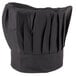 A black Chef Revival chef hat with a pleated brim and adjustable head band.