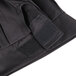 A close up of a black fabric Chef Revival chef hat.
