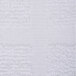 A close up of a white fabric bath mat with a pattern.
