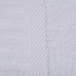 A close up of an Oxford Signature white bath sheet with a stripe.