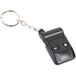 A black Turn-O-Matic wireless remote control attached to a key chain.