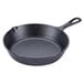 A Lodge black cast iron skillet with a handle.