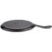 A Lodge black cast iron fajita skillet with a handle.