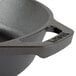 A Lodge pre-seasoned cast iron skillet with a handle.