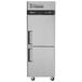 a white refrigerator with a black handle