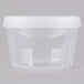 A clear plastic container with a white lid.