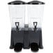 Two Carlisle black plastic beverage dispensers with black bases.