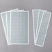 Curtron insect trap glue boards with white rectangular papers and white squares.