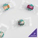 Clear wrapped packages of Customizable Spearmint Starlite candy with a logo.