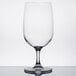 A clear plastic water goblet by Carlisle.