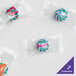 Clear packages of Customizable Spearmint Starlite candies with labels.