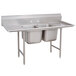 An Advance Tabco stainless steel sink with two sinks and two drainboards.