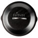 A black Lodge cast iron lid with a close-up of the handle.